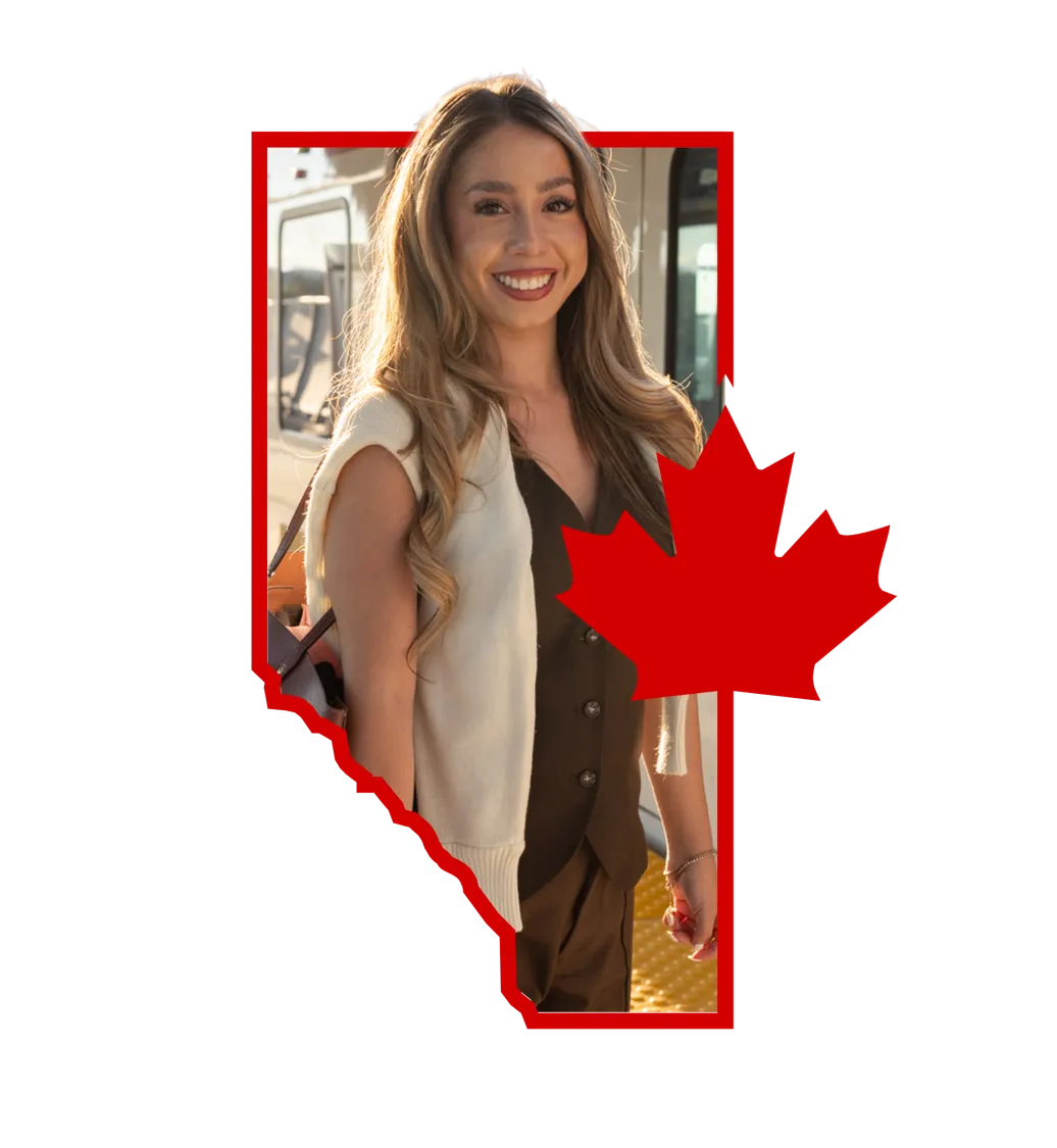 Smiling young woman standing inside the outline of the province of Alberta with a red maple leaf