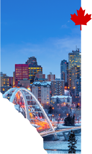 Edmonton skyline and Walterdale Bridge illuminated at dusk in winter